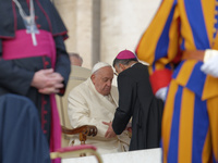 Pope Francis talks with a Cardinal at the end of his weekly General Audience at St. Peter's Square in Vatican City, on November 13, 2024. (