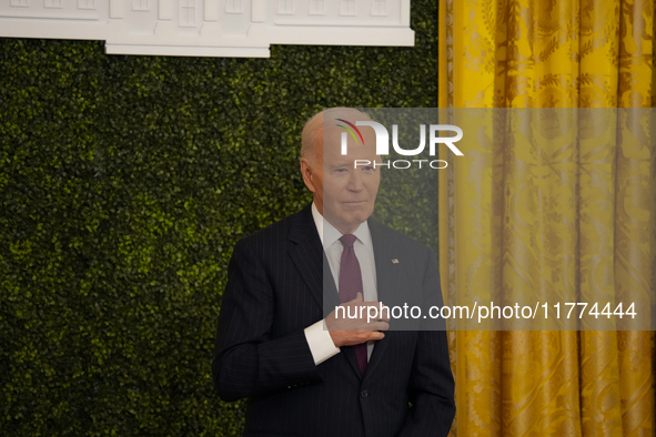 U.S. President Joe Biden listens to first lady Jill Biden speak during the Classroom to Career Summit in the East Room of the White House on...