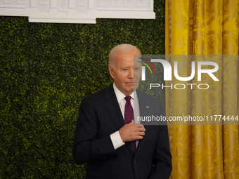 U.S. President Joe Biden listens to first lady Jill Biden speak during the Classroom to Career Summit in the East Room of the White House on...