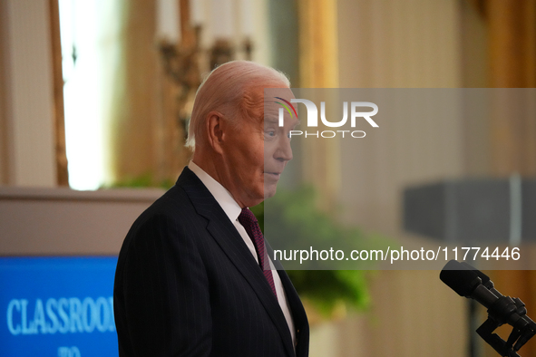 U.S. President Joe Biden listens to first lady Jill Biden speak during the Classroom to Career Summit in the East Room of the White House on...