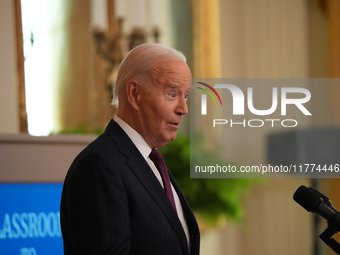 U.S. President Joe Biden listens to first lady Jill Biden speak during the Classroom to Career Summit in the East Room of the White House on...