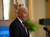 U.S. President Joe Biden listens to first lady Jill Biden speak during the Classroom to Career Summit in the East Room of the White House on...