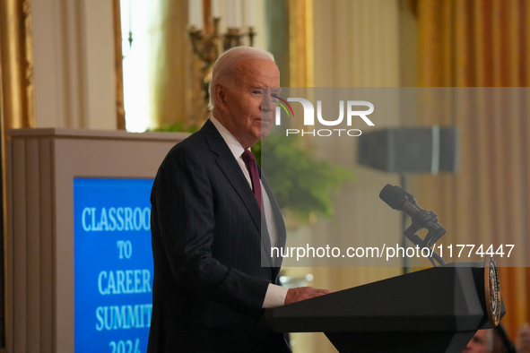 U.S. President Joe Biden listens to first lady Jill Biden speak during the Classroom to Career Summit in the East Room of the White House on...