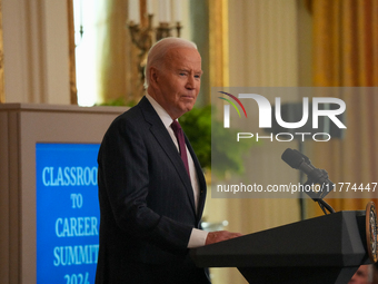 U.S. President Joe Biden listens to first lady Jill Biden speak during the Classroom to Career Summit in the East Room of the White House on...