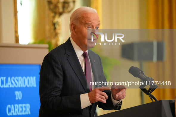 U.S. President Joe Biden listens to first lady Jill Biden speak during the Classroom to Career Summit in the East Room of the White House on...