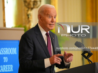 U.S. President Joe Biden listens to first lady Jill Biden speak during the Classroom to Career Summit in the East Room of the White House on...