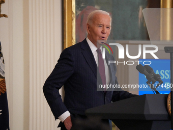 U.S. President Joe Biden listens to first lady Jill Biden speak during the Classroom to Career Summit in the East Room of the White House on...