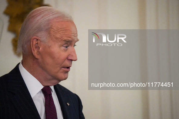 U.S. President Joe Biden listens to first lady Jill Biden speak during the Classroom to Career Summit in the East Room of the White House on...