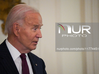 U.S. President Joe Biden listens to first lady Jill Biden speak during the Classroom to Career Summit in the East Room of the White House on...