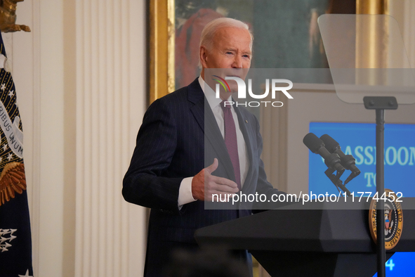 U.S. President Joe Biden listens to first lady Jill Biden speak during the Classroom to Career Summit in the East Room of the White House on...