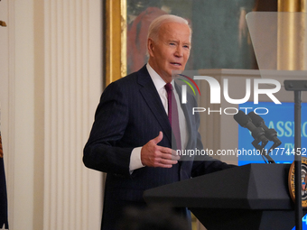 U.S. President Joe Biden listens to first lady Jill Biden speak during the Classroom to Career Summit in the East Room of the White House on...