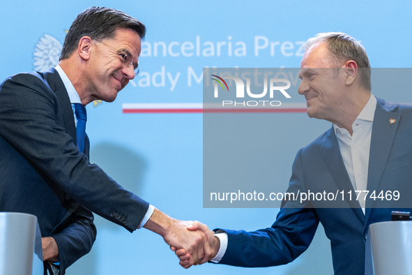 NATO Secretary General Mark Rutte (L) and Polish Prime Minister Donald Tusk (R)  at a press conference after their meeting  in Warsaw, Polan...