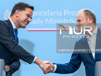 NATO Secretary General Mark Rutte (L) and Polish Prime Minister Donald Tusk (R)  at a press conference after their meeting  in Warsaw, Polan...