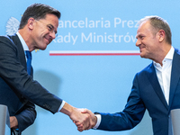 NATO Secretary General Mark Rutte (L) and Polish Prime Minister Donald Tusk (R)  at a press conference after their meeting  in Warsaw, Polan...