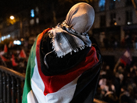 Protesters hold placards and wave Palestinian flags during a rally organized by political parties (La France Insoumise - LFI, Les Ecologiste...