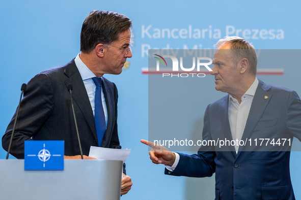 NATO Secretary General Mark Rutte (L) and Polish Prime Minister Donald Tusk (R)  at a press conference after their meeting  in Warsaw, Polan...