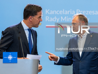 NATO Secretary General Mark Rutte (L) and Polish Prime Minister Donald Tusk (R)  at a press conference after their meeting  in Warsaw, Polan...