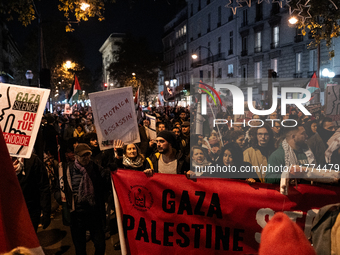 Protesters hold placards and wave Palestinian flags during a rally organized by political parties (La France Insoumise - LFI, Les Ecologiste...