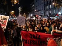 Protesters hold placards and wave Palestinian flags during a rally organized by political parties (La France Insoumise - LFI, Les Ecologiste...