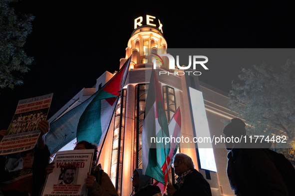 Protesters hold placards and wave Palestinian flags during a rally organized by political parties (La France Insoumise - LFI, Les Ecologiste...