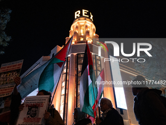 Protesters hold placards and wave Palestinian flags during a rally organized by political parties (La France Insoumise - LFI, Les Ecologiste...