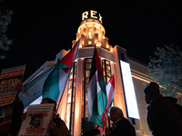 Protesters hold placards and wave Palestinian flags during a rally organized by political parties (La France Insoumise - LFI, Les Ecologiste...