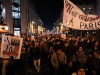 Protesters hold placards and wave Palestinian flags during a rally organized by political parties (La France Insoumise - LFI, Les Ecologiste...