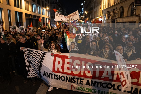 Protesters hold placards and wave Palestinian flags during a rally organized by political parties (La France Insoumise - LFI, Les Ecologiste...