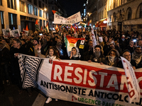 Protesters hold placards and wave Palestinian flags during a rally organized by political parties (La France Insoumise - LFI, Les Ecologiste...