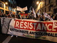 Protesters hold placards and wave Palestinian flags during a rally organized by political parties (La France Insoumise - LFI, Les Ecologiste...