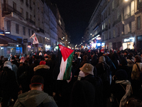 Protesters hold placards and wave Palestinian flags during a rally organized by political parties (La France Insoumise - LFI, Les Ecologiste...