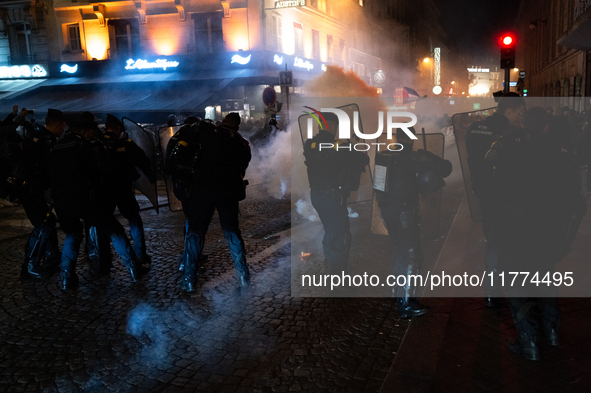 Smoke from tear gas canisters rises as protesters clash with French Gendarmes during a rally organized by political parties (La France Insou...