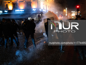 Smoke from tear gas canisters rises as protesters clash with French Gendarmes during a rally organized by political parties (La France Insou...