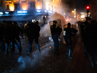 Smoke from tear gas canisters rises as protesters clash with French Gendarmes during a rally organized by political parties (La France Insou...