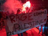 Protesters hold a banner that reads ''the rage as in Palestine'' on an Amsterdam street during a rally organized by political parties (La Fr...