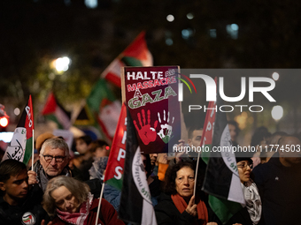 Protesters hold placards and wave Palestinian flags during a rally organized by political parties (La France Insoumise - LFI, Les Ecologiste...