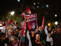 Protesters hold placards and wave Palestinian flags during a rally organized by political parties (La France Insoumise - LFI, Les Ecologiste...