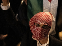 Protesters hold placards and wave Palestinian flags during a rally organized by political parties (La France Insoumise - LFI, Les Ecologiste...