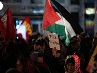 Protesters hold placards and wave Palestinian flags during a rally organized by political parties (La France Insoumise - LFI, Les Ecologiste...