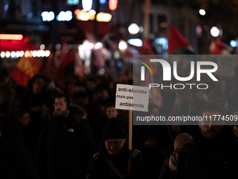 Protesters hold placards and wave Palestinian flags during a rally organized by political parties (La France Insoumise - LFI, Les Ecologiste...