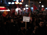 Protesters hold placards and wave Palestinian flags during a rally organized by political parties (La France Insoumise - LFI, Les Ecologiste...