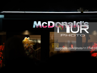 Protesters vandalize the windows of a McDonald's restaurant during a rally organized by political parties (La France Insoumise - LFI, Les Ec...