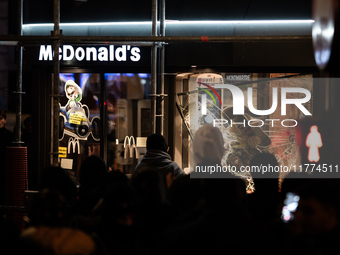 Protesters vandalize the windows of a McDonald's restaurant during a rally organized by political parties (La France Insoumise - LFI, Les Ec...