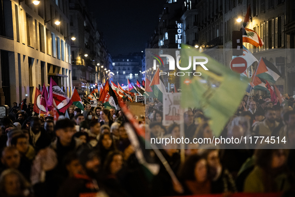 Protesters hold placards and wave Palestinian flags during a rally organized by political parties (La France Insoumise - LFI, Les Ecologiste...