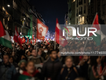 Protesters hold placards and wave Palestinian flags during a rally organized by political parties (La France Insoumise - LFI, Les Ecologiste...