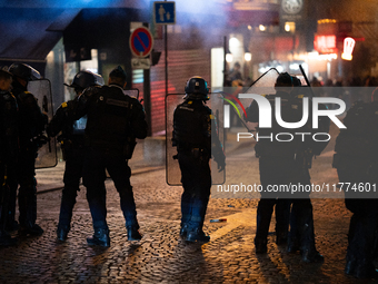 Protestors clash with French gendarmes during a rally organized by political parties (La France Insoumise - LFI, Les Ecologistes - EELV, and...