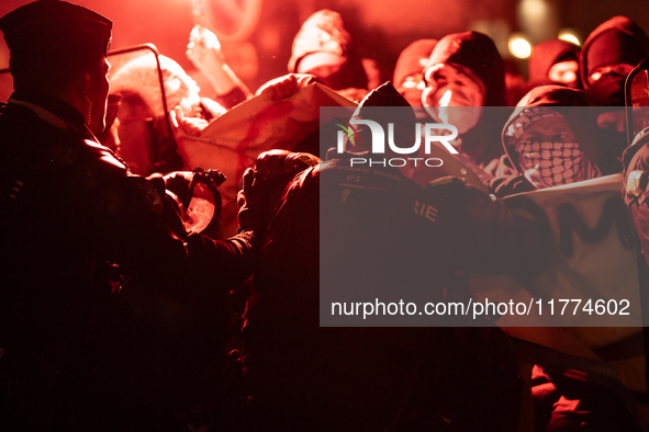 Protestors clash with French gendarmes during a rally organized by political parties (La France Insoumise - LFI, Les Ecologistes - EELV, and...