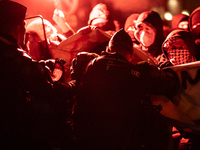 Protestors clash with French gendarmes during a rally organized by political parties (La France Insoumise - LFI, Les Ecologistes - EELV, and...