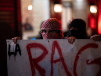 Protesters hold a banner that reads ''the rage as in Palestine'' on an Amsterdam street during a rally organized by political parties (La Fr...