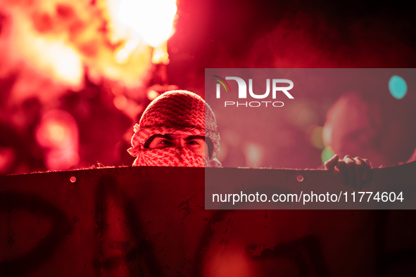 Protesters hold a banner that reads ''the rage as in Palestine'' on an Amsterdam street during a rally organized by political parties (La Fr...